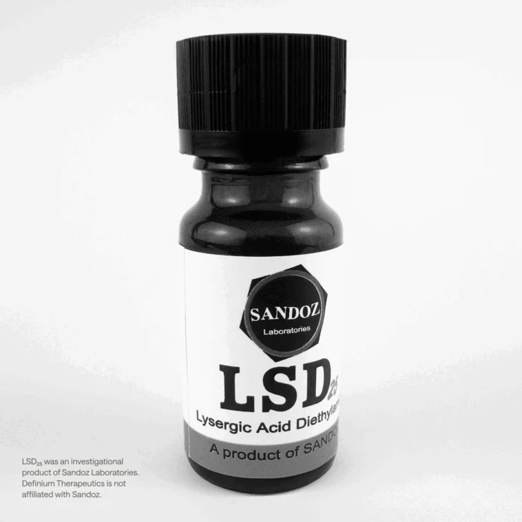 A small black bottle labeled "LSD Lysergic Acid Diethylamide" with a Sandoz Laboratories logo, standing on a white background.