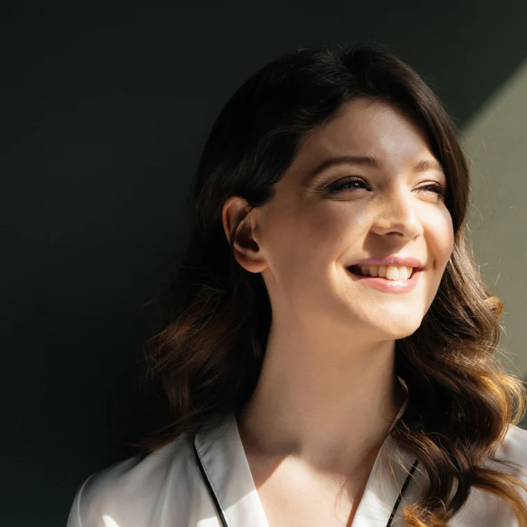 Woman smiling.